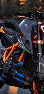 Vibrant motorcycle with orange accents at night.
