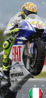 Motorcycle performing a wheelie on a track, showcasing vibrant colors and dynamic action.