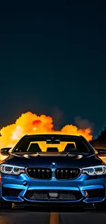 Vibrant blue BMW driving at night with explosion in the background.