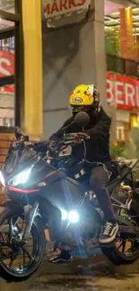 Motorcyclist in vibrant urban night ride setting with sleek bike.