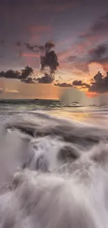 Breathtaking ocean sunset with vivid sky and dynamic waves crashing on the shore.