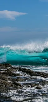 Dynamic ocean wave with vivid blue colors and rocky shoreline.