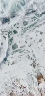 Aerial view of ocean waves crashing, with white sea foam texture.