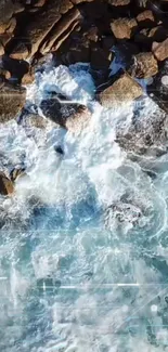 Aerial view of ocean waves crashing against rocky shore.