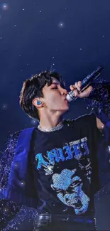 Energetic performer under a vibrant night sky with microphone.