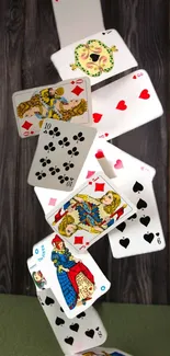 Dynamic cascade of playing cards on a dark wooden background.
