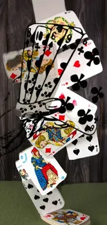 Playing cards dynamically arranged in a creative art style against a wooden background.