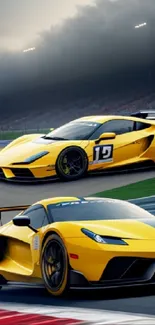 Two sleek yellow race cars speeding on a track.