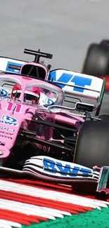 Exciting racing car in dynamic pink livery on track.