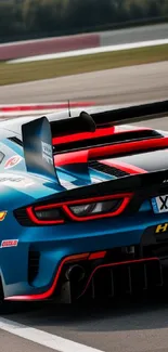 A vibrant racing car with blue and red accents speeding on a track.