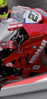 Close-up of red racing motorcycle in motion.