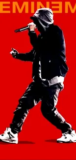 Silhouette of a rapper on a red background with bold graphics.