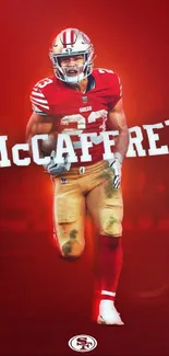 Energetic football player in red uniform on dynamic wallpaper.