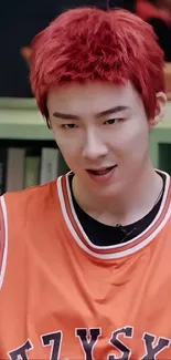 Wallpaper of a person with red hair and an orange sports jersey.