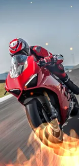 Red motorcycle speeding on track under clear sky.