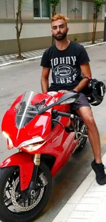 Man on red motorcycle in urban street setting.