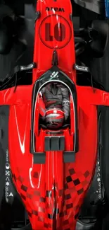 A vibrant red racing car viewed from above, showcasing dynamic design.