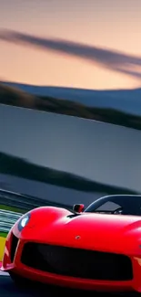 Red sports car speeding on track at sunset.