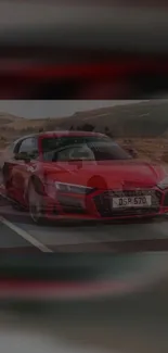 Red sports car driving on an open road, showcasing dynamic design.