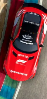 Overhead shot of a red sports car on a track.