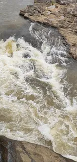 Dynamic river flow with rushing water and rocks, capturing the essence of nature.