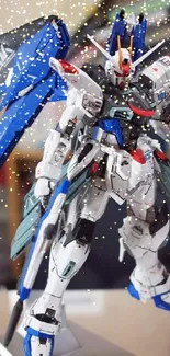 Intricate Gundam-style robot model wallpaper with blue highlights.