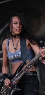 Energetic female bassist playing live on stage with a rock music vibe.