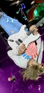 High-energy guitarist performing on a vibrant purple-lit stage.