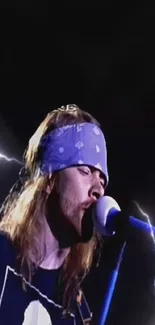 Rock star performing with lightning and microphone on stage.