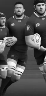 Monochrome image of rugby players engaged in a dynamic match.