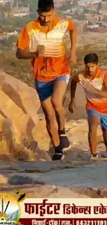 Athletes running uphill in orange attire.