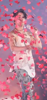 Singer energetically performing amidst cascading pink petals on stage.