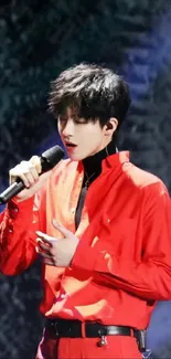 Singer performing passionately in a red outfit with a microphone.