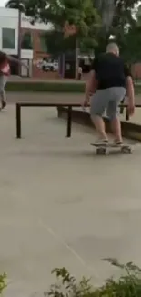 Two skateboarders in action at an urban park on a vibrant day.