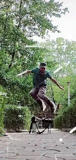 Skater jumping in a green park setting with trees.