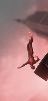 Superhero jumps from a skyscraper against a cloudy rose-colored sky.