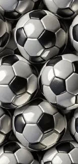 Collage of black and white soccer balls in a dynamic pattern.