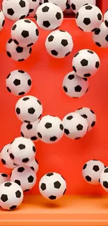 Soccer balls on vibrant orange background.
