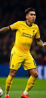 Soccer player in yellow uniform on the field.