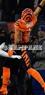 Athlete making a dynamic jump in vivid orange outfit, sports theme wallpaper.