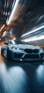 A sleek sports car speeds through a tunnel at night, displaying dynamic motion blur.