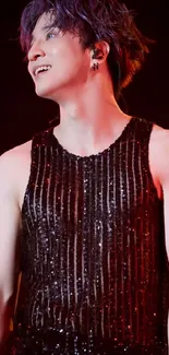 Dynamic stage performer in sparkling outfit.