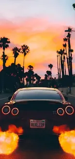 A sports car driving into a fiery sunset with palm trees in the background.