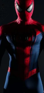 Superhero in vibrant red and blue suit on dark background.