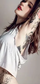 Stylish woman with tattoos in artful pose.