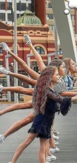 Urban dance group in dynamic pose on a city bridge.