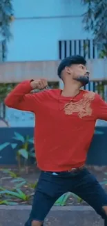 Young man in red outfit with urban style background