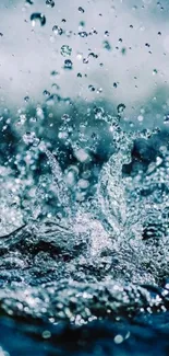 Dynamic water splash wallpaper with vibrant blue tones.