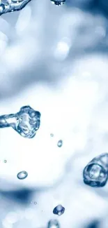 Dynamic splash of water against blue background wallpaper.