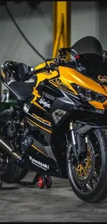 Dynamic yellow motorcycle in garage setting, perfect for wallpaper.